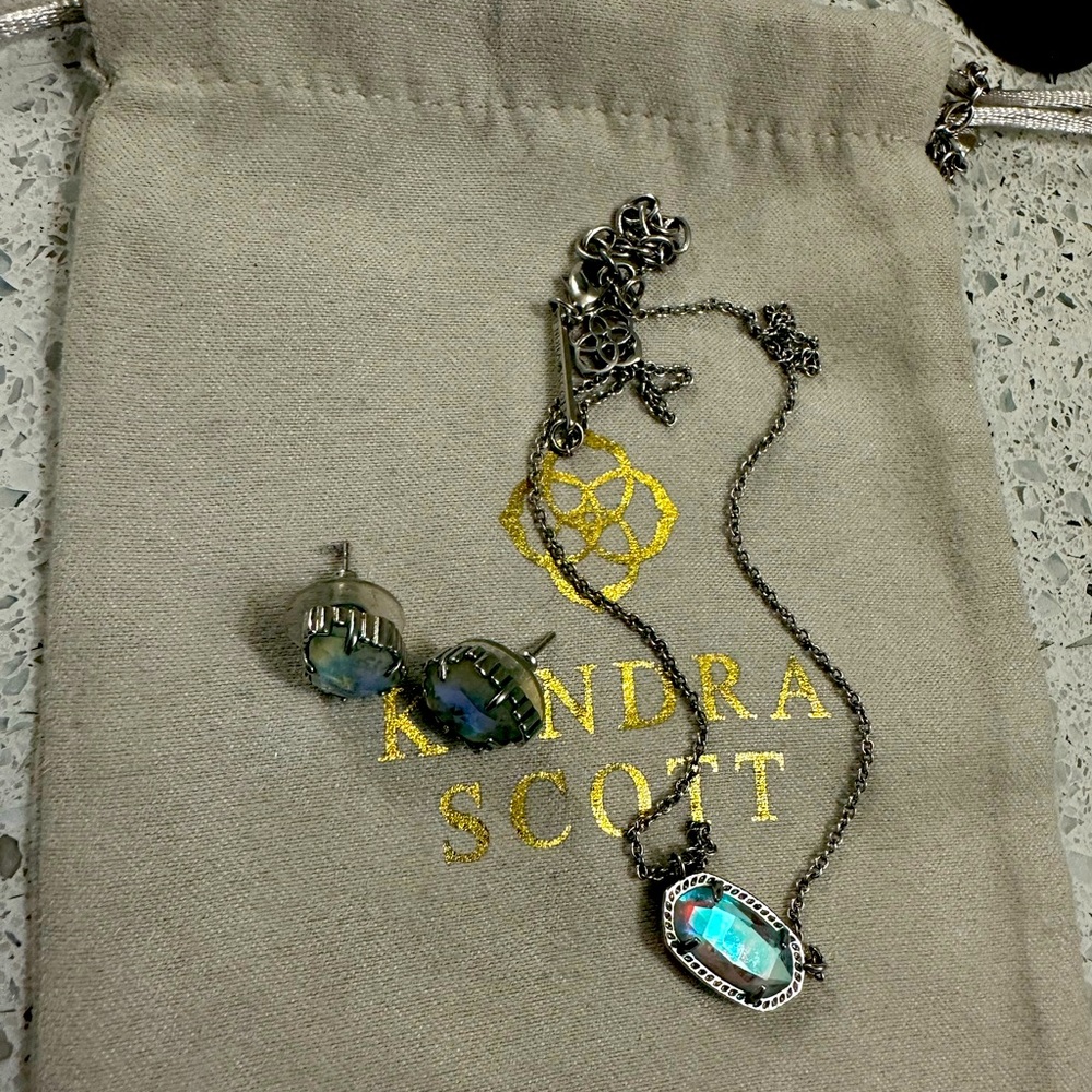 Kendra Scott set. Silver with blue tinted clear irredescent stone. Sold as a set